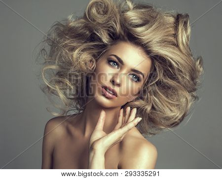 Beautiful Blond Woman With Curly Long Hair