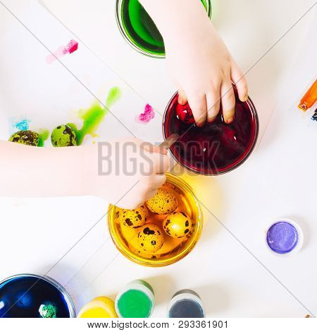 Preparation For Easter. Painting Small Quail Eggs For Easter Hunter. Colorful Paints For Egg's Decor