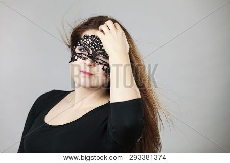Pretty Mysterious Woman Wearing Black Eye Lace Mask Having Long Brown Hair.