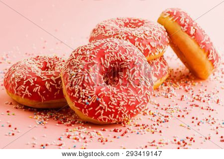 Five Coral Donuts Lying Together.