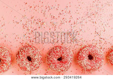 Five Coral Donuts. Donuts With Icing On Pink Background.
