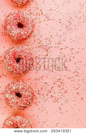 Five Coral Donuts. Donuts With Icing On Pink Background.