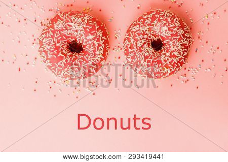 Two Coral Donuts. Donuts With Icing On Pink Background.