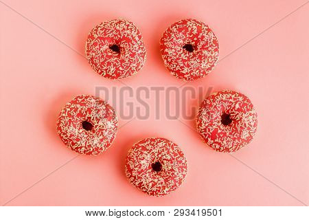 Five Coral Donuts. Donuts With Icing On Pink Background.