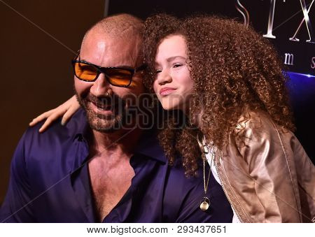 LAS VEGAS - APR 02:  Dave Bautista and Chloe Coleman arrives for the CinemaCon 2019 - STXfilms presentation 