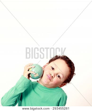 Little Boy With Globe In His Hand With White Background Stock Photo