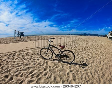 Black Retro Bicycle Down The Sunshine Of California At Spring In America, West Coast