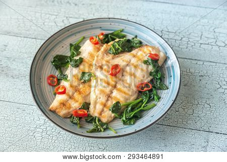Grilled Sea Bream Fish Fillet With Spinach And Chili Pepper