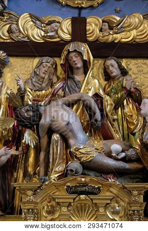 LUCERNE, SWITZERLAND - JUNE 24, 2018: Mary with the body of Christ on her knees statue on the Soul Altar altar in the church of St. Leodegar in Lucerne, Switzerland