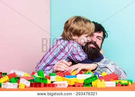 Father And Son Create Constructions. Bearded Man And Son Play Together. Surefire Ways To Bond With Y