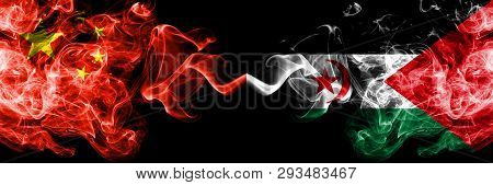 China Vs Sahrawi Smoke Flags Placed Side By Side. Thick Colored Silky Smoke Flags Of Chinese And Sah