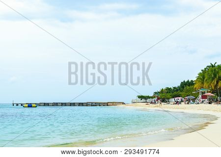 Idyllic Tropical Island Caribbean Summer Vacation. Coconut Palm Trees, Beach Scene.
