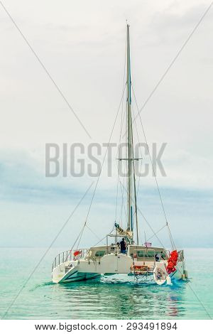 Catamaran Sailing/navigating In The Tropical Caribbean Sea