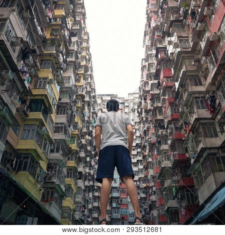 A Tourist Man With Yick Fat Building In Travel Hong Kong Concept, Quarry Bay. Residential Area In Ol