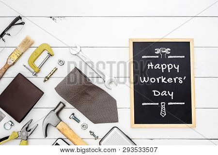 Happy Workers' Day Background Concept. Flat Lay Of Construction Blue Collar Handy Tools And White Co