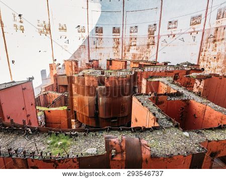 Inside Round Ruined And Abandoned Nuclear Rector Room In Crimean Destroyed Npp, Rusty Steel Equipmen