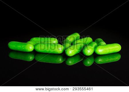 Lot Of Whole Green Sweet Licorice Comfit Isolated On Black Glass