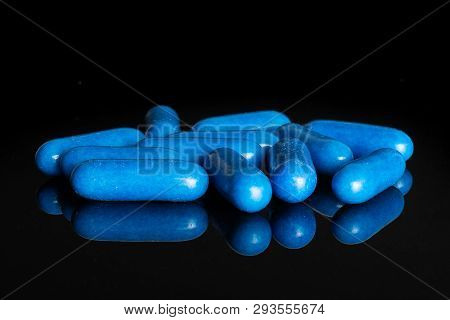 Lot Of Whole Blue Sweet Licorice Comfit Isolated On Black Glass