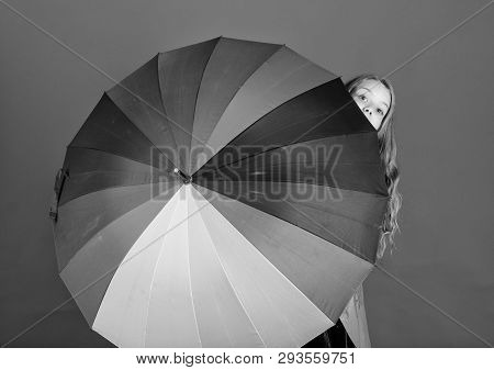 Girl Cheerful Hide Behind Umbrella. Colorful Umbrella Accessory. Weather Forecast Concept. Stay Posi
