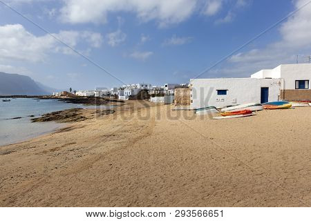 Beach With Boats On The Sand And White Houses In Caleta De Sebo On The Island La Graciosa Of Lanzaro