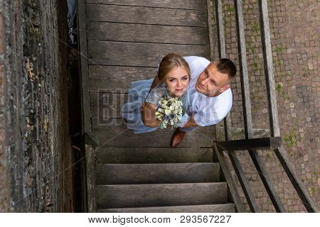 Happy Bride And Groom Walking On Gren Golf Course Outdoors, Copy Space. Wedding Couple In Love, Newl