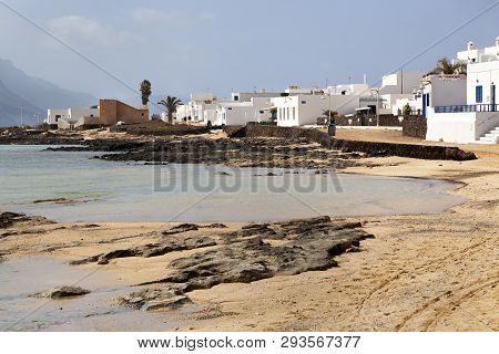 Sand And White Houses At The Coast Of Caleta De Sebo On The Island La Graciosa Of Lanzarote