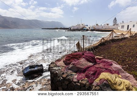 Fishing Nets Drying At The Coast Of Village Caleta De Sebo On The Island La Graciosa Of Lanzarote