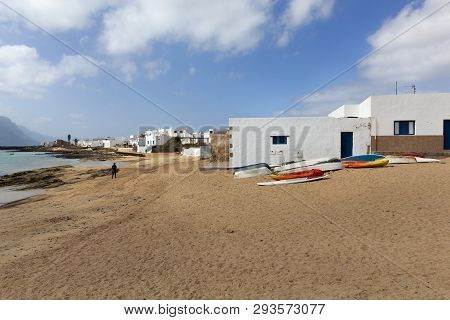 Beach With Boats On The Sand And White Houses In Caleta De Sebo On The Island La Graciosa Of Lanzaro