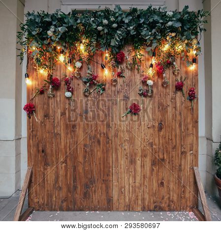Rustic Wedding Photo Zone. Hand Made Wedding Decorations Includes Photo Booth  Red Flowers. Garlands