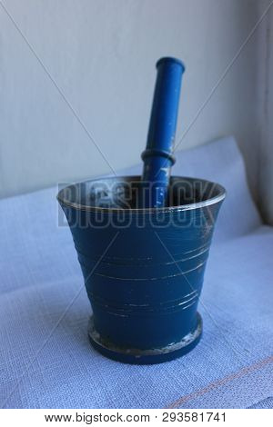 Ancient Metal Mortar With Pestle On Linen Background