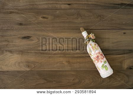 Wine Bottle On Wooden Table.vintage Style Of Wine Bottle With Retro Decoation Object.winery Bottle P