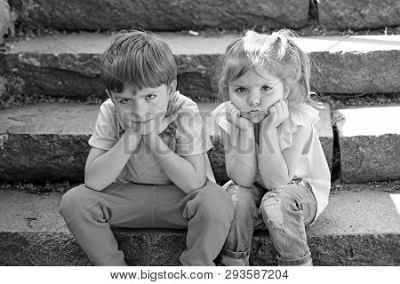 Small Girl And Boy On Stairs. Relations. Summer Vacation. Childhood First Love. Couple Of Little Chi