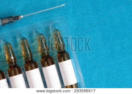 Vaccination Medical Pharmacy Objects. Syringe With Needle And Vaccine Ampules Set Macro. Kids Or Adu