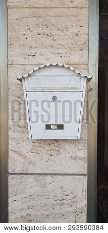 White Metal Vintage Mail Box Closed With A Key Hang On Stone Building Wall
