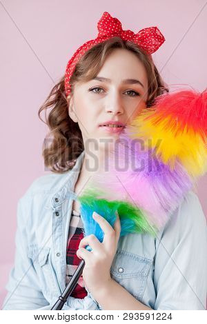 Cleaning Pin Up Woman. Smiling Pinup Girl Holds Colorful Duster Brush. Cleaning Service. Pin-up Girl