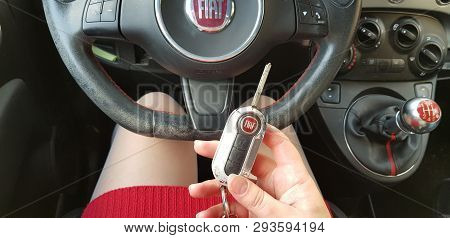 Rishon Lezion, Israel - February 28, 2019: Woman In Red Mini Dress Sitting On Drivers Seat Of Mini S