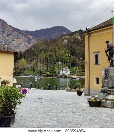 Traveler And Lake With Port In Lenno Near Chiesa Di Santo Stefano Piazza