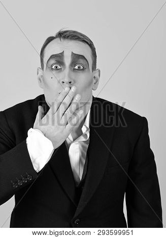 Keeping Secret. Mime Artist Cover Mouth With Hand. Mime With Face Paint. Man Actor With Mime Makeup.