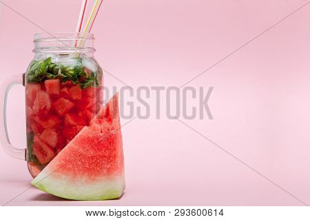 Watermelon Smoothie With Slice Of Fruit And Leaf Of Mint Over Pink Background, Copy Space, Close Up