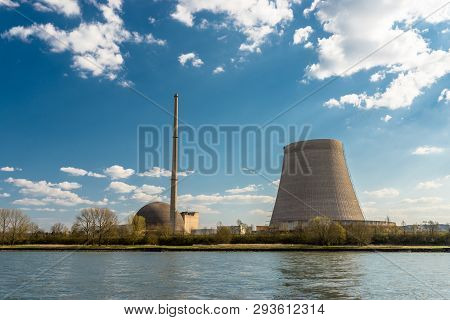 A Half-dismantled Nuclear Atomic Chimney Against A Blue Sky With Clouds In Mulheim-karlich In Wester