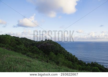 Paragliding Hill Watugupit At Yogyakarta, Beautiful View Of Hill And Sea With Blue Sky And Clouds