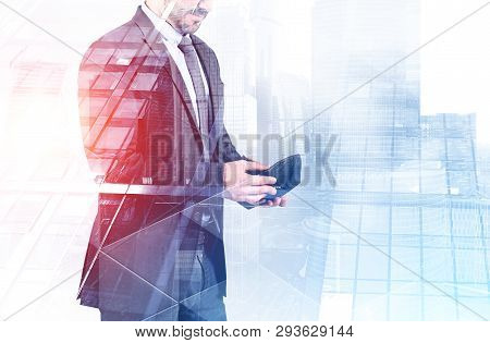 Unrecognizable Businessman Standing With Empty Wallet In Modern City. Concept Of Bankruptcy. Toned I