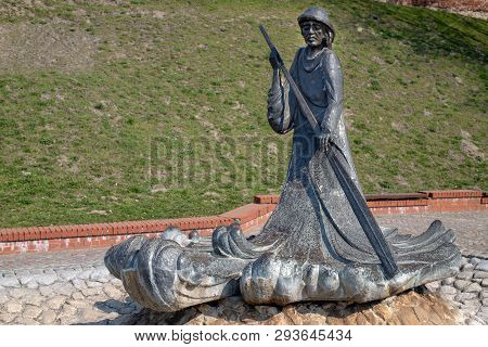 Grudziadz, Kujawsko-pomorskie / Poland - April, 5, 2019: Monument Of A Fisherman On The Vistula Rive