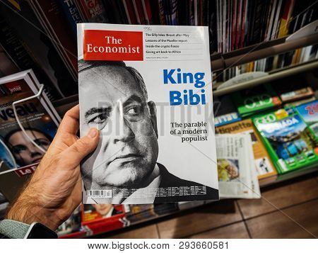 Paris, France - 29 Mar 2019: Man Reading The Economist Magazine With Portrait Of Benjamin Netanyahu 