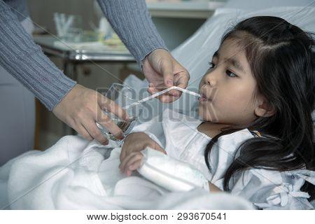 Heal Kid Heal Patient Drink Water Hospital Bed. Close Up Shot Parent Hand Feeding Water With Straw F