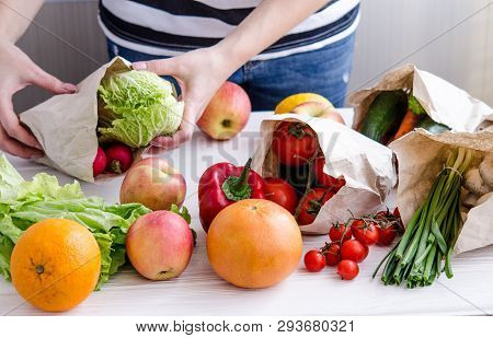 Women's Hands Lay Out Eco Vegan Products