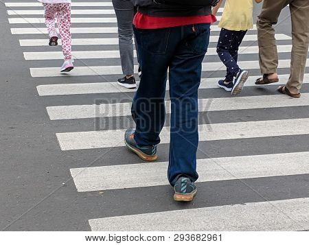Jakarta, Indonesia - February 16, 2019: Some People Walking On The Pelican Crossing On Jalan Thamrin