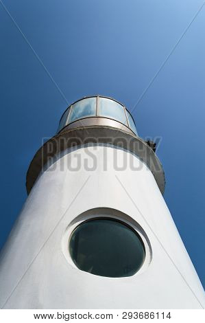 View From Below On The Dongbaekseom Lighthouse In Dongbaek Park On Sunny Day