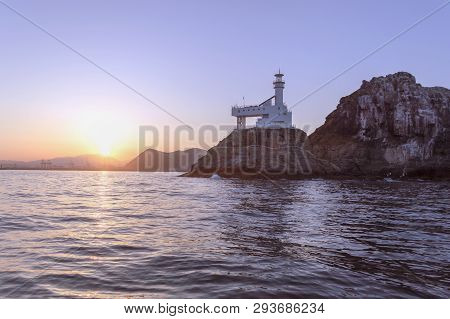 Deungdaedo (lighthouse) Island In Busan, South Korea At Sunset View From The Sea