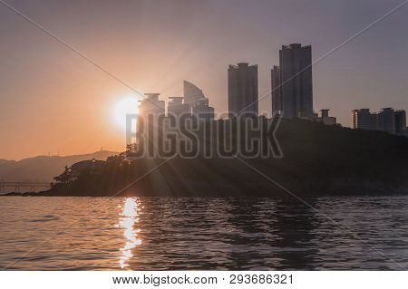 Golden Sunset In Busan With Park And Skyscrapers View From The Sea